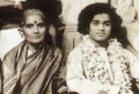 A sepia photograph of Mother Easwaramma with Bhagawan Sri Sathya Sai Baba